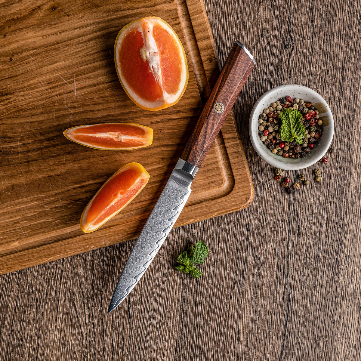 Cuchillo Utilitario 12cm 10Cr+Espina Damasco66 oct Palo Rosa Africano tabla de picar naranja y pimienta