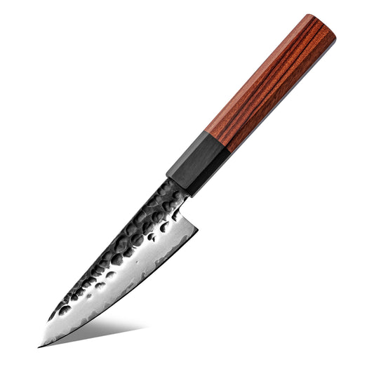 Cuchillo Puntilla 10cm AUS-10 Clad Kurouchi Martillado Mango Mkuruti y Ebano con fondo blanco.